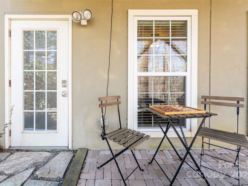 3 Angel Circle, Asheville, NC 28803.  MLS# CAR4238450, YatesRealty ID 13542. Basement patio