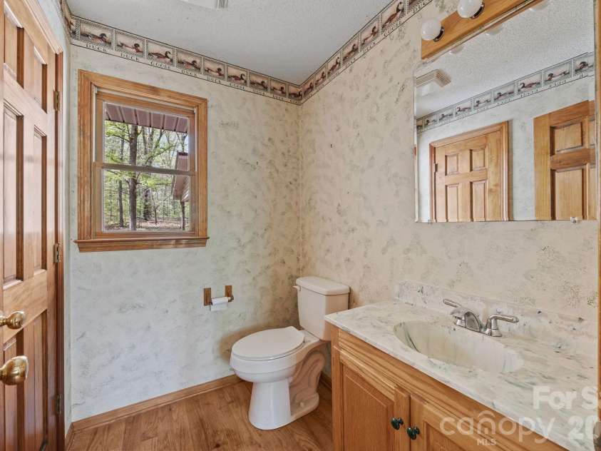 425 Hickory Hill Road, Salisbury, NC 28144.  MLS# CAR4369648, YatesRealty ID 13544. Half bath off laundry room area
