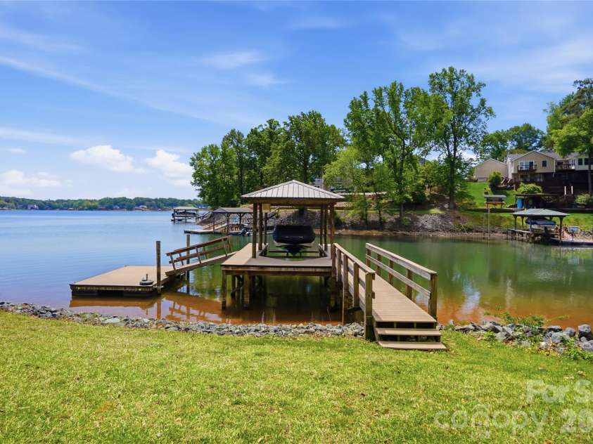 19011 Kailua Circle, Tega Cay, SC 29708.  MLS# CAR4367824, YatesRealty ID 13553. Covered dock with lift and floating dock