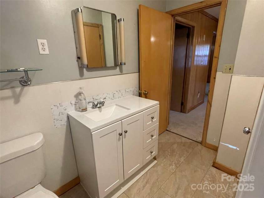 8725 Bringle Ferry Road, Salisbury, NC 28146.  MLS# CAR4218468, YatesRealty ID 1356. Bathroom with updated vanity