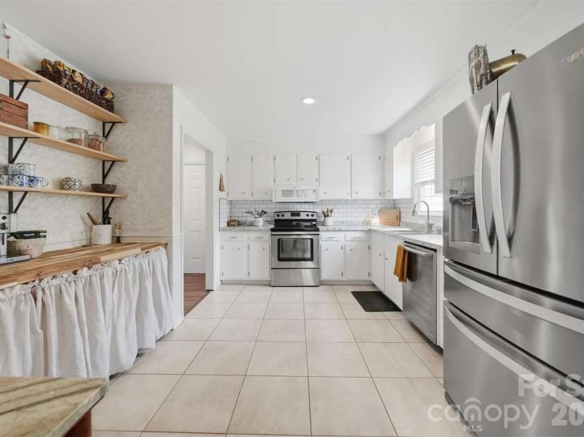 1730 Hamilton Street, Hickory, NC 28602.  MLS# CAR4368375, YatesRealty ID 13562. Kitchen with extra nook featuring open shelving