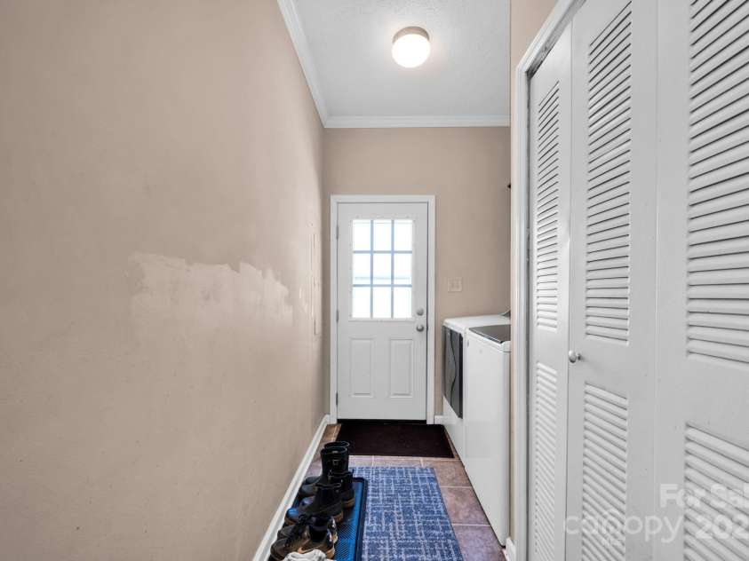 126 Top Flite Drive, Statesville, NC 28677.  MLS# CAR4245940, YatesRealty ID 13563. Main floor laundry room