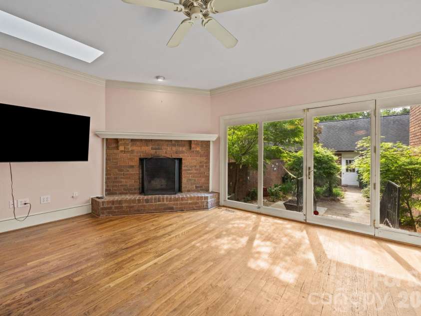 1709 Dilworth Road, Charlotte, NC 28203.  MLS# CAR4369058, YatesRealty ID 13579. Fireplace and courtyard view
