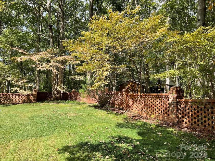 701 Whippoorwill Lane, Concord, NC 28025.  MLS# CAR4188719, YatesRealty ID 1358. Bricked backyard