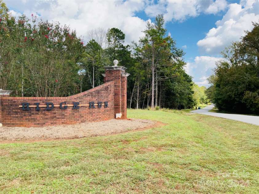 701 Whippoorwill Lane, Concord, NC 28025.  MLS# CAR4188719, YatesRealty ID 1358. Ridge Run Entrance