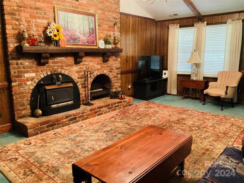 701 Whippoorwill Lane, Concord, NC 28025.  MLS# CAR4188719, YatesRealty ID 1358. Unique fireplace built with historical brick