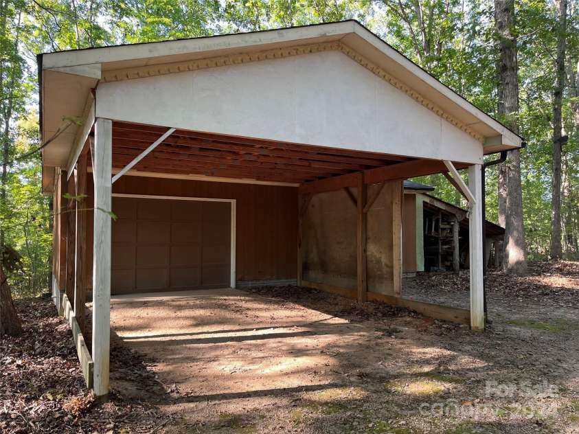 701 Whippoorwill Lane, Concord, NC 28025.  MLS# CAR4188719, YatesRealty ID 1358. Workshop with two car garage with two car .carport.