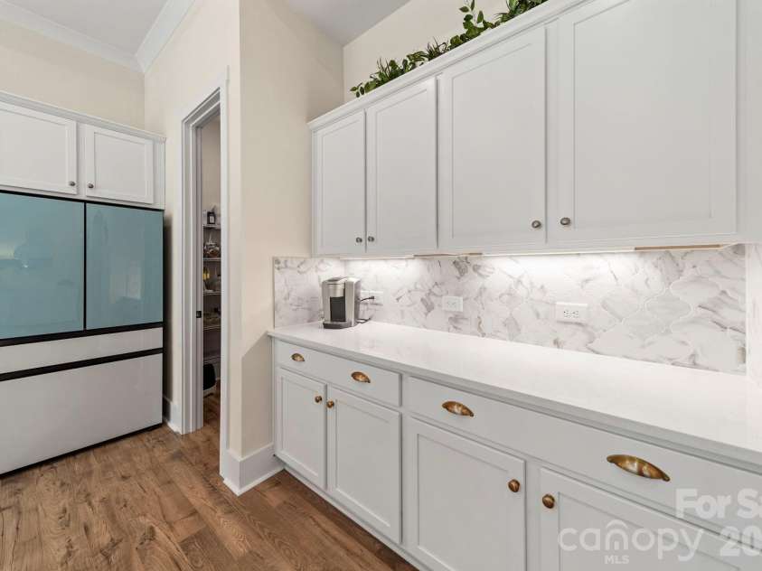 14083 Bobby Jones Drive, Lancaster, SC 29720.  MLS# CAR4356019, YatesRealty ID 13581. Kitchen Cabinets with Gold Hardware and Under Cabinet Light Strips