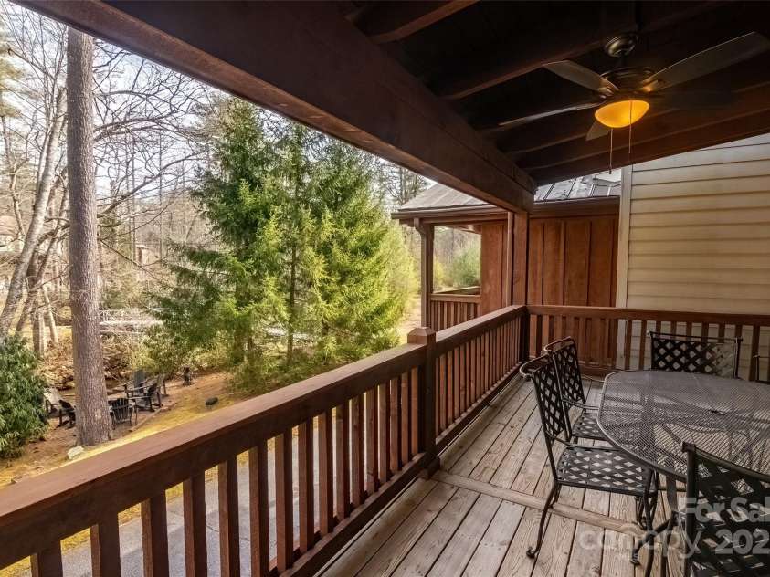 620 Sapphire Valley Road, Cashiers, NC 28717.  MLS# CAR4329121, YatesRealty ID 1359. Covered wooden deck on the rear of Unit 
