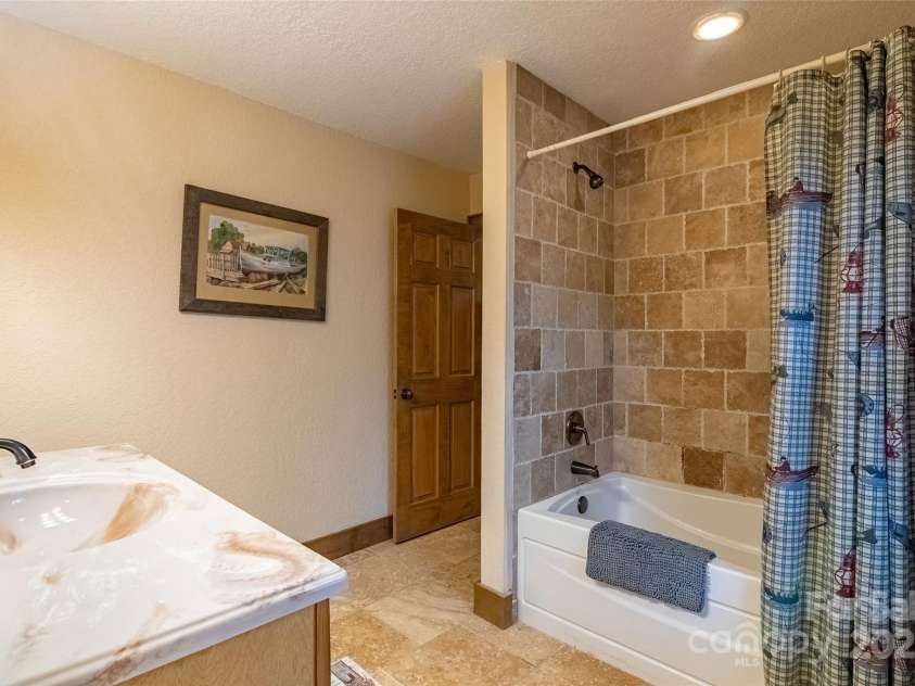 620 Sapphire Valley Road, Cashiers, NC 28717.  MLS# CAR4329121, YatesRealty ID 1359. En-Suite #2 Bathroom on the front side of the building.