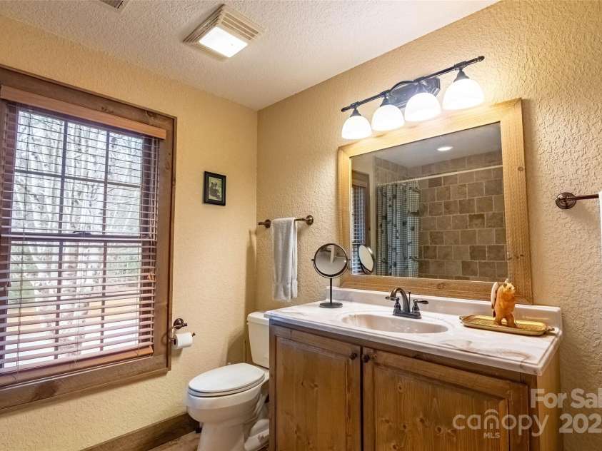 620 Sapphire Valley Road, Cashiers, NC 28717.  MLS# CAR4329121, YatesRealty ID 1359. En-Suite #2 Bathroom on the front side of the building.