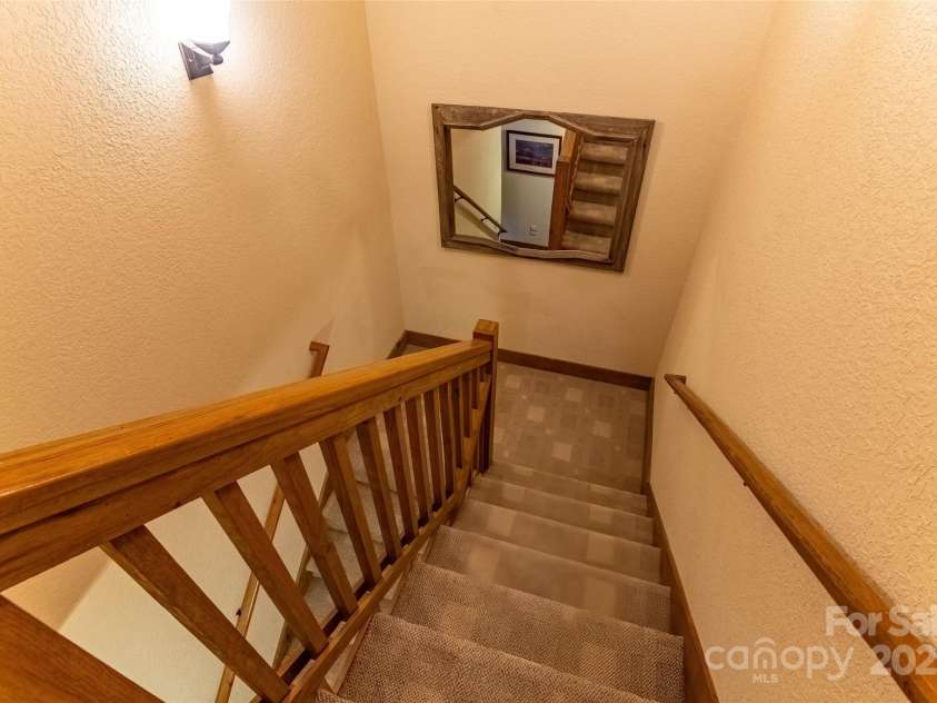620 Sapphire Valley Road, Cashiers, NC 28717.  MLS# CAR4329121, YatesRealty ID 1359. Typical staircase between the floors.