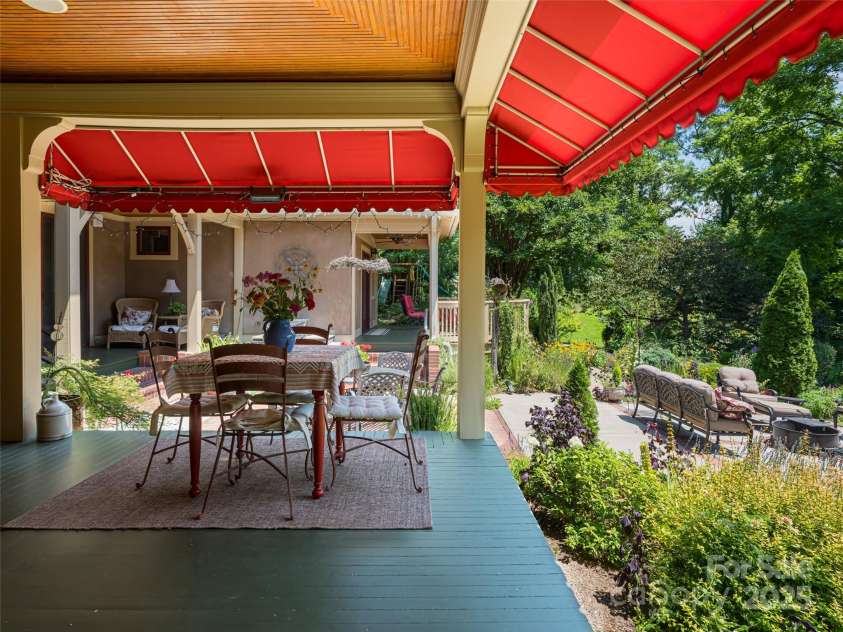 9 West Street Extension, Asheville, NC 28801.  MLS# CAR4299248, YatesRealty ID 13591. Wrap-Around Porch offers many Niches for Gathering