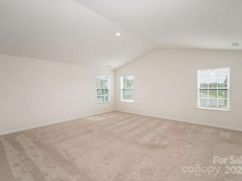 138 Maritime Street, Mooresville, NC 28117.  MLS# CAR4251677, YatesRealty ID 13592. Primary Bedroom with Vaulted Ceilings