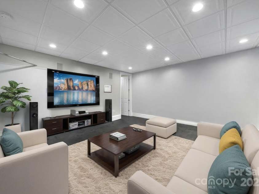 411 Belo Court, Fort Mill, SC 29715.  MLS# CAR4223656, YatesRealty ID 13593. Gym area virtually staged as a tv room