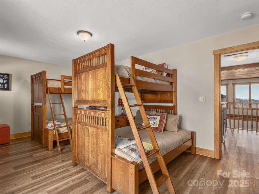 330 Vista Drive, Mars Hill, NC 28754.  MLS# CAR4229157, YatesRealty ID 13598. Upper level bedroom, 2 sets of bunk beds allows for home to sleep 10.