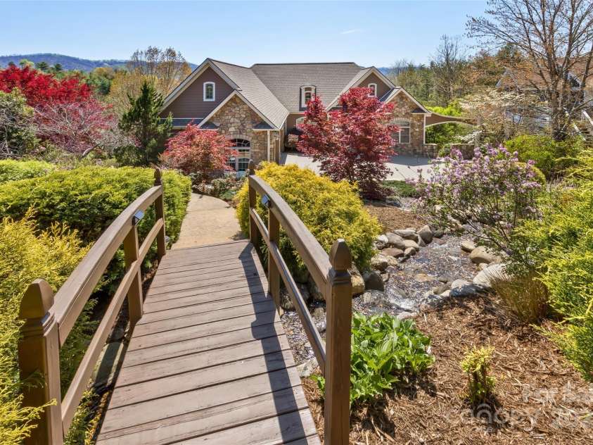 22 Valley Drive, Weaverville, NC 28787.  MLS# CAR4244497, YatesRealty ID 13599. Bridge at the front walkway leading to the house
