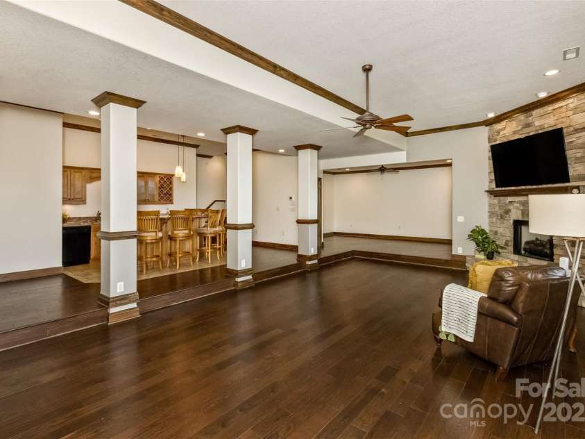 22 Valley Drive, Weaverville, NC 28787.  MLS# CAR4244497, YatesRealty ID 13599. Family room with gas-log ventless fireplace