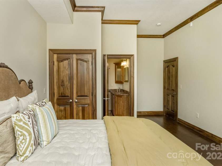 22 Valley Drive, Weaverville, NC 28787.  MLS# CAR4244497, YatesRealty ID 13599. Lower level guest bedroom