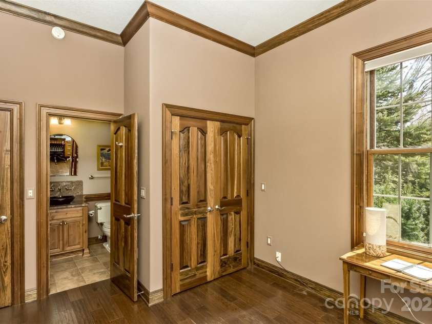 22 Valley Drive, Weaverville, NC 28787.  MLS# CAR4244497, YatesRealty ID 13599. Second lower level bedroom with ensuite bath