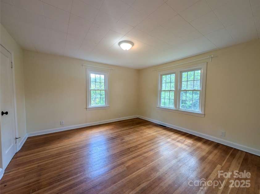 95 Lady Bug Lane, Burnsville, NC 28714.  MLS# CAR4206406, YatesRealty ID 13600. Bedroom off from living area