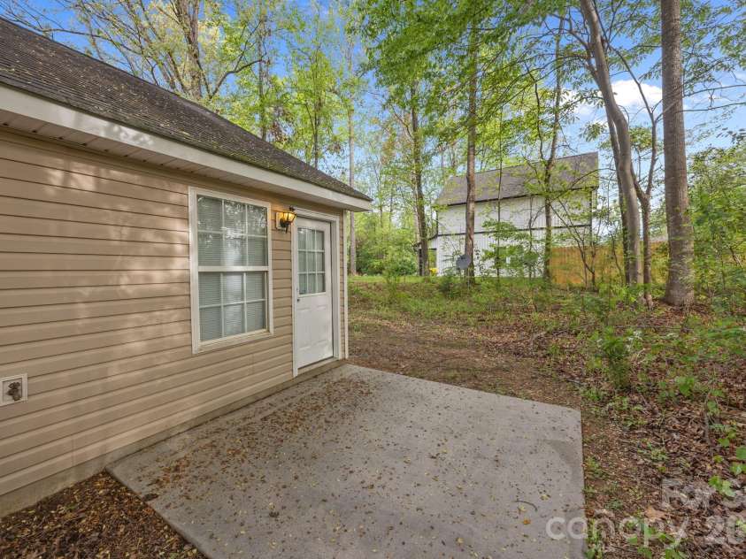 2246 Sunset Boulevard, Charlotte, NC 28269.  MLS# CAR4366304, YatesRealty ID 13610. Back of Home with Patio