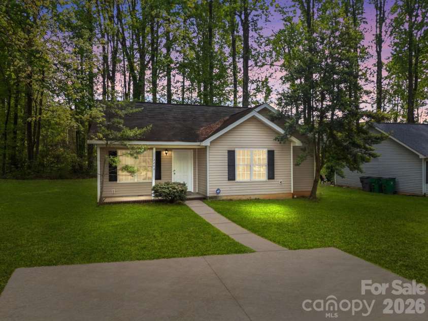 2246 Sunset Boulevard, Charlotte, NC 28269.  MLS# CAR4366304, YatesRealty ID 13610. Front of Home at Twilight