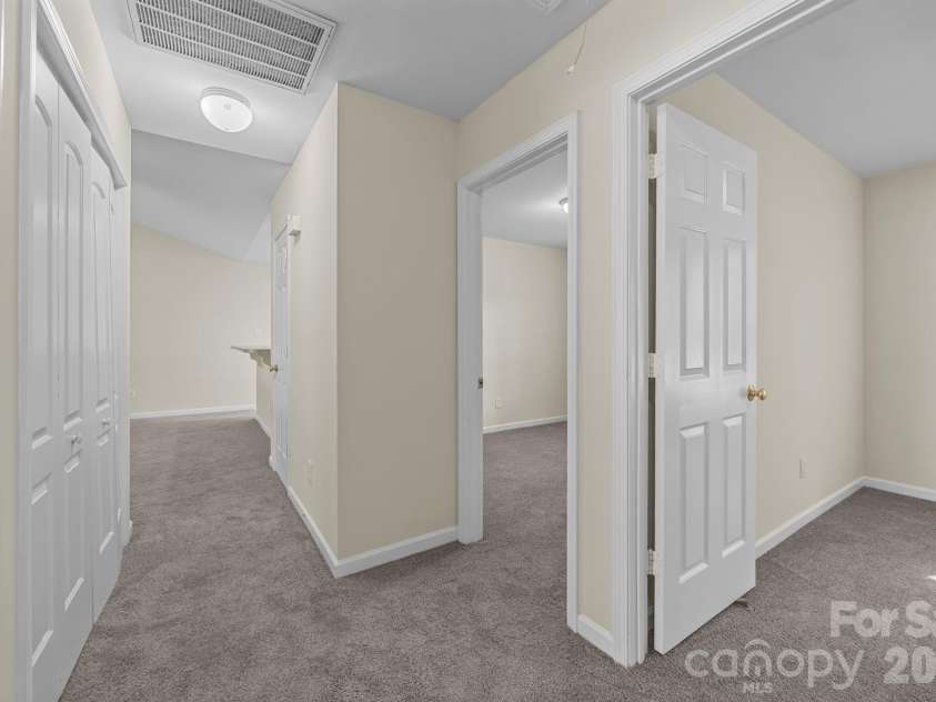 2246 Sunset Boulevard, Charlotte, NC 28269.  MLS# CAR4366304, YatesRealty ID 13610. View from Hallway to Bedrooms to the Living Room