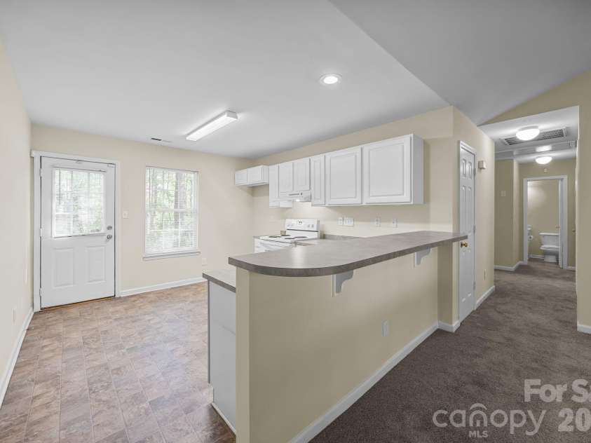 2246 Sunset Boulevard, Charlotte, NC 28269.  MLS# CAR4366304, YatesRealty ID 13610. View from Living Room to the Kitchen
