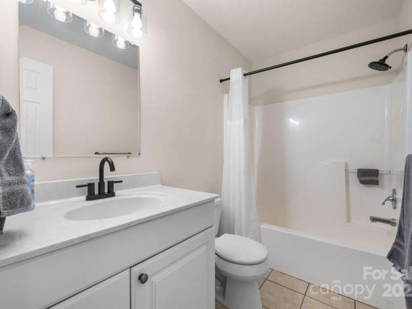 892 Plantation Drive, Marion, NC 28752.  MLS# CAR4228017, YatesRealty ID 13610. Hall bath