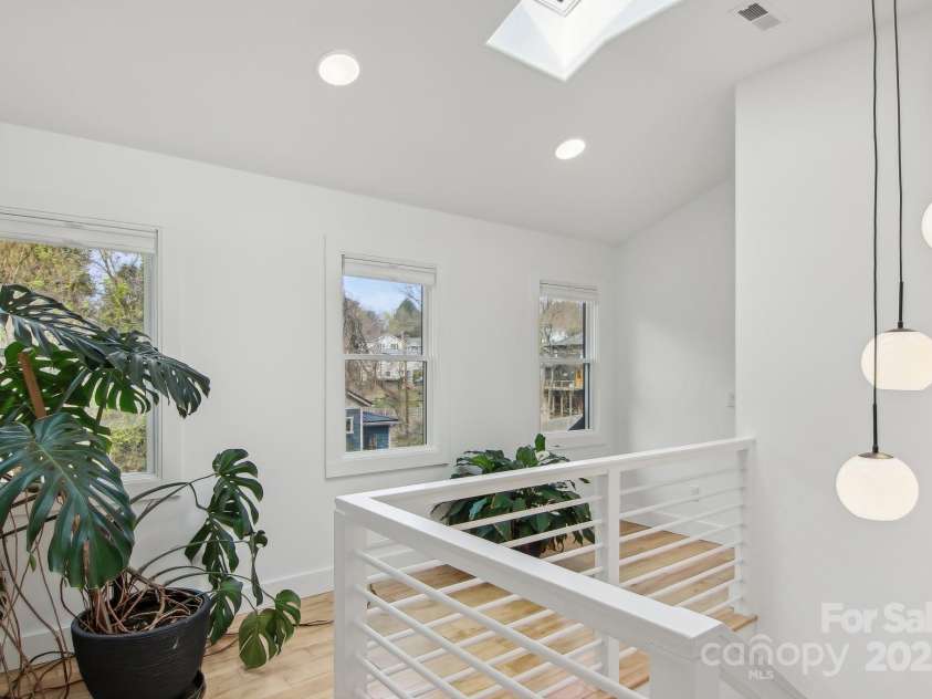 65 Wellington Street, Asheville, NC 28806.  MLS# CAR4234732, YatesRealty ID 13612. Light filled stairwell