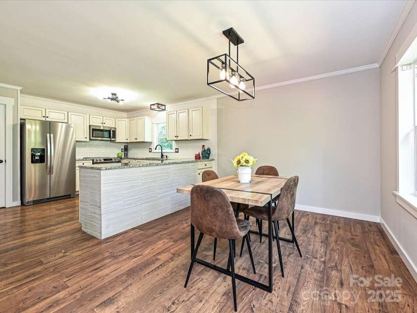 9565 Man O War Road, Indian Land, SC 29707.  MLS# CAR4253660, YatesRealty ID 13613. The dining area overlooks the private backyard area