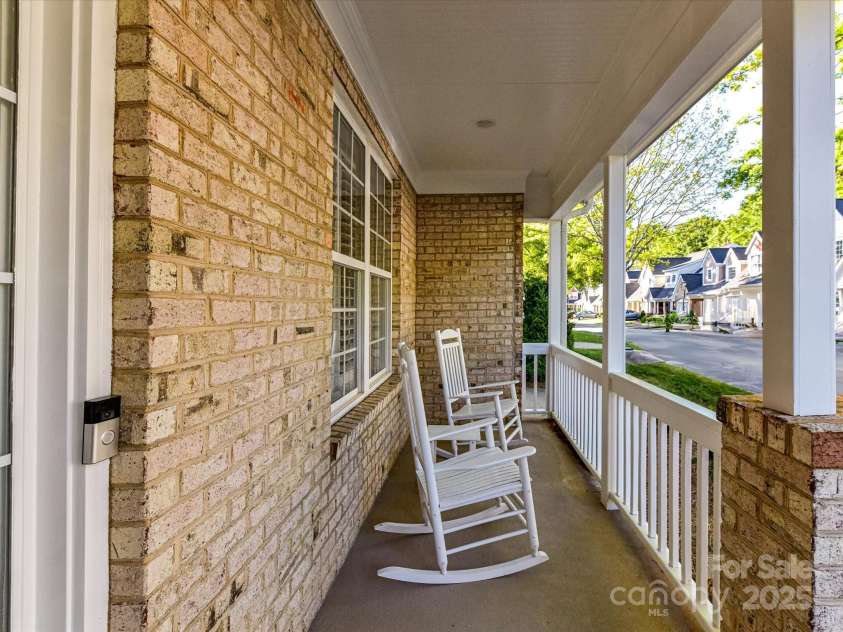 4407 Coventry Row Court, Charlotte, NC 28270.  MLS# CAR4244073, YatesRealty ID 13615. Rocking Chair Front Porch