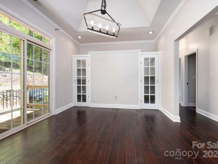 62 Mackenzie Way, Swannanoa, NC 28778.  MLS# CAR4320694, YatesRealty ID 13625. Dinning Room with Tray Ceiling and Built In Shelving. Deck Access 