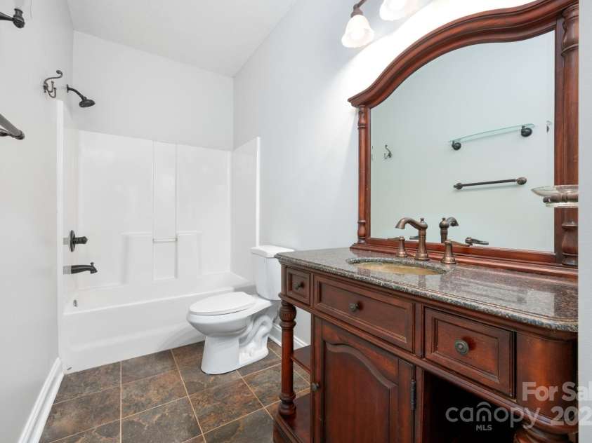 62 Mackenzie Way, Swannanoa, NC 28778.  MLS# CAR4320694, YatesRealty ID 13625. Second Bathroom with Antique Vanity and Tile 