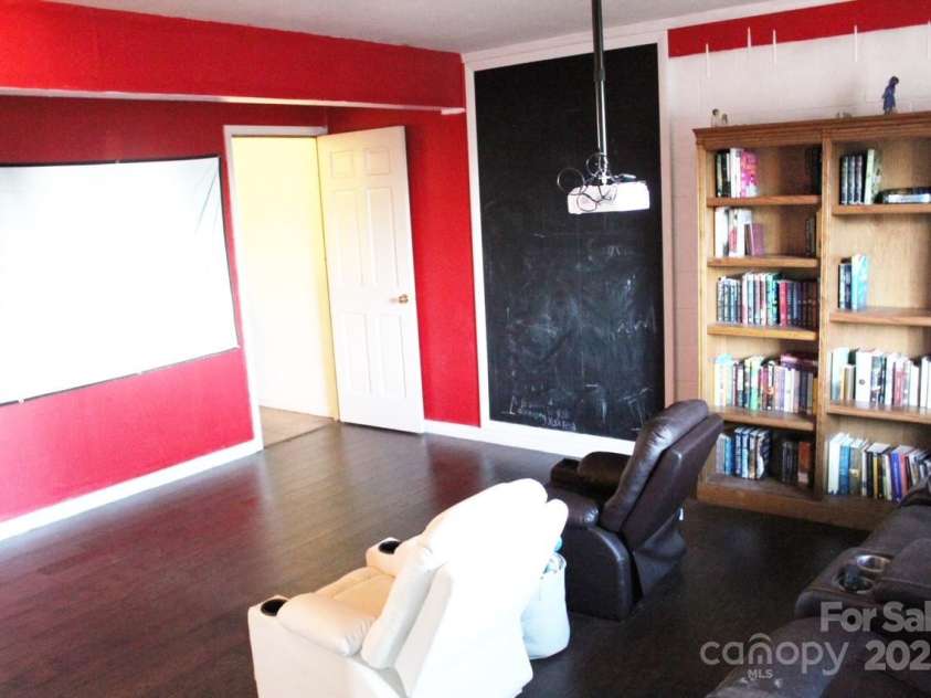 141 Charity Lane, Candler, NC 28715.  MLS# CAR4204175, YatesRealty ID 1364. Basement Family Room