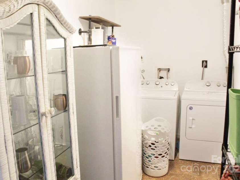 141 Charity Lane, Candler, NC 28715.  MLS# CAR4204175, YatesRealty ID 1364. Basement Laundry Room