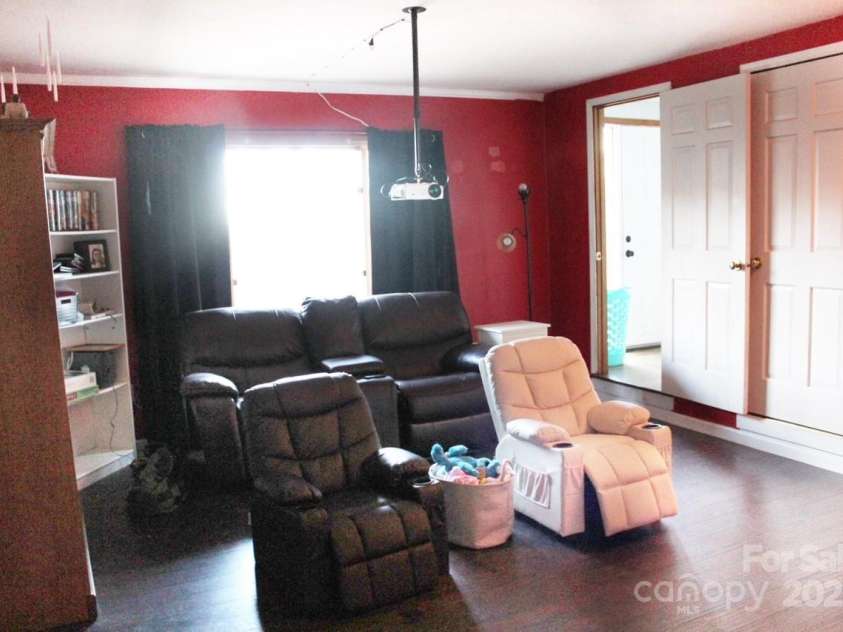 141 Charity Lane, Candler, NC 28715.  MLS# CAR4204175, YatesRealty ID 1364. Family room in Basement