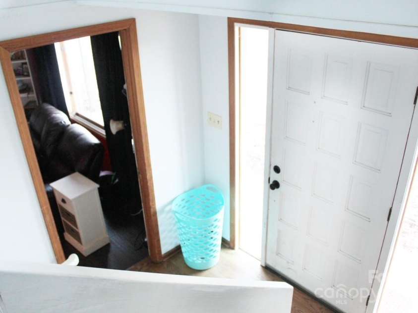 141 Charity Lane, Candler, NC 28715.  MLS# CAR4204175, YatesRealty ID 1364. Stairway from upstairs