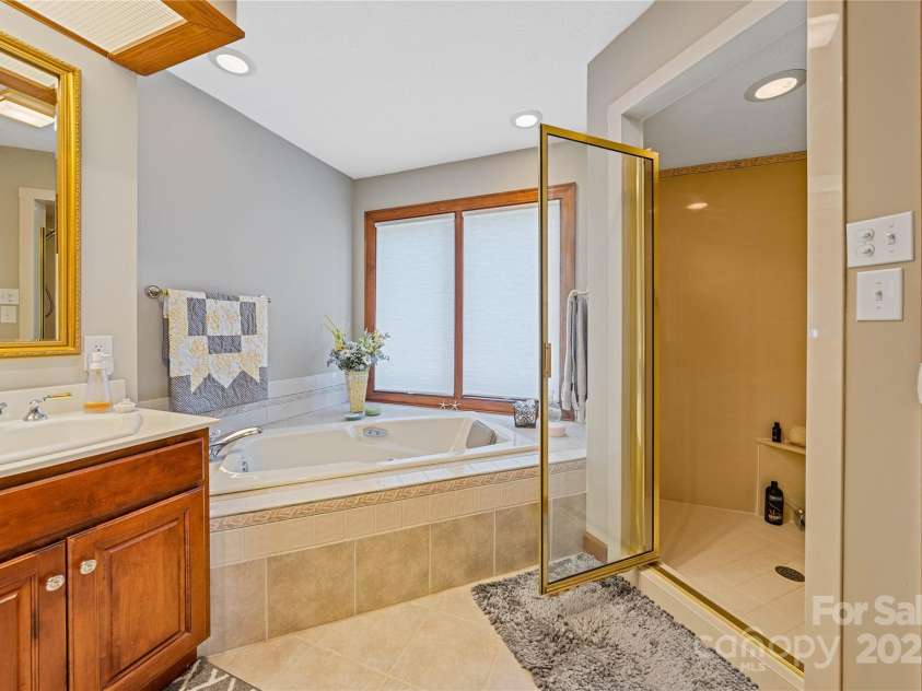 3001 Hickory Nut Trail, Hendersonville, NC 28739.  MLS# CAR4234402, YatesRealty ID 13641. Primary suite continued... with shower & linen closet