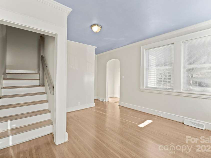 3724 Commonwealth Avenue, Charlotte, NC 28205.  MLS# CAR4287119, YatesRealty ID 13643. Living room and stairs to 2nd floor