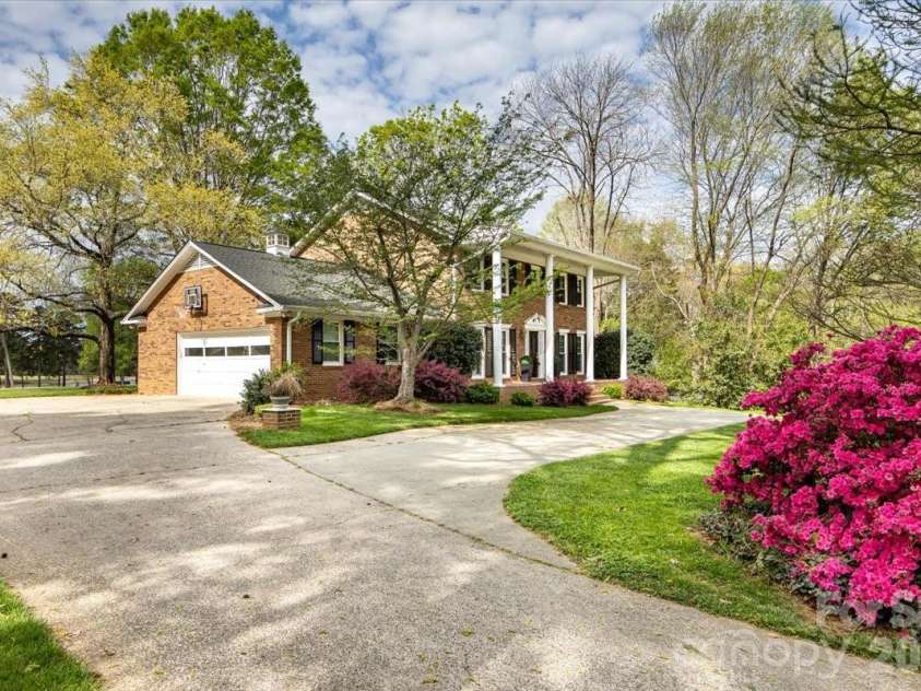 5918 Foxcrest Drive, Mint Hill, NC 28227.  MLS# CAR4364106, YatesRealty ID 13647. Side angle of exterior