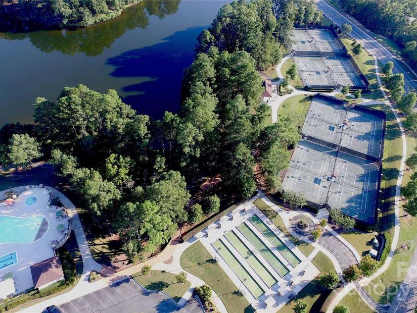 3052 Santee Court, Indian Land, SC 29707.  MLS# CAR4235308, YatesRealty ID 13653. Bocce and tennis courts can be seen as you drive along Del Webb Boulevard. Pickleball courts can be found on the other side of The Lake House, as well as at The Lodge, and Water's Edge Park.