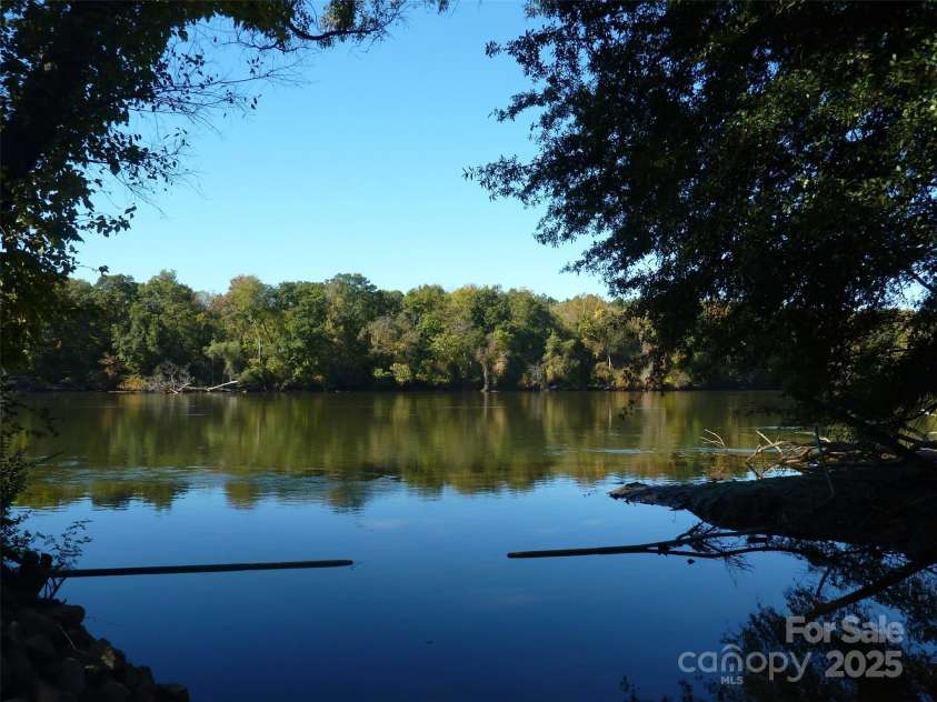 3052 Santee Court, Indian Land, SC 29707.  MLS# CAR4235308, YatesRealty ID 13653. Catawba River access near the kayak center is reached via delightful walk or golf-cart ride along a tree-lined trail near Water's Edge Park.