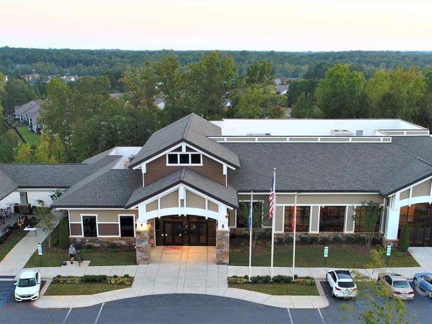 3052 Santee Court, Indian Land, SC 29707.  MLS# CAR4235308, YatesRealty ID 13653. The Lodge houses an outdoor pool, pickleball courts, outside workout stations, a pavilion and open outdoor area where you can relax by the large firepit. It is home to SCCL's Performing Arts Club and the interior ballr