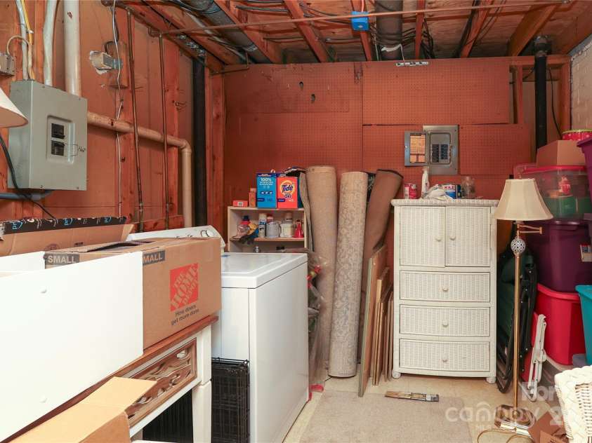8306 Knights Bridge Road, Charlotte, NC 28210.  MLS# CAR4257820, YatesRealty ID 13656. Additional Angle of Basement, Seller is using for storage pre-move, excuse the clutter!