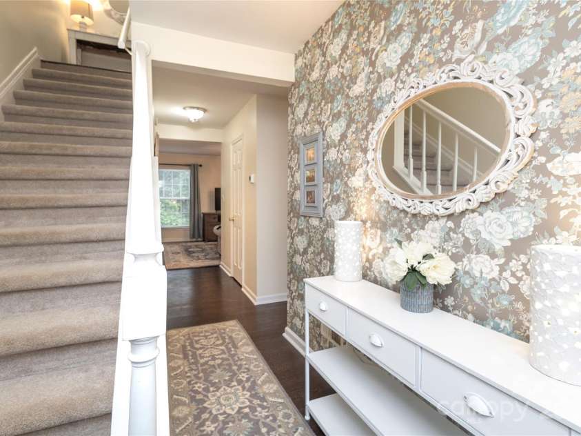 8306 Knights Bridge Road, Charlotte, NC 28210.  MLS# CAR4257820, YatesRealty ID 13656. Entrance foyer with lovely wallpaper and wood floors.