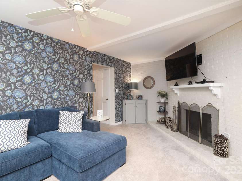 8306 Knights Bridge Road, Charlotte, NC 28210.  MLS# CAR4257820, YatesRealty ID 13656. Lower level Den/Family Room wood burning fireplace.  Owner uses!  Fireplace sold As-Is but no known problems.