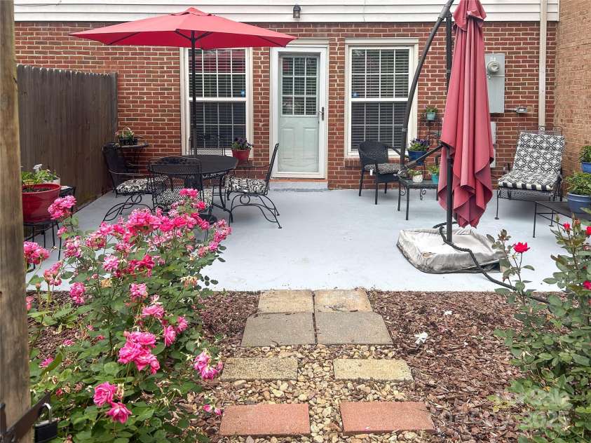 8306 Knights Bridge Road, Charlotte, NC 28210.  MLS# CAR4257820, YatesRealty ID 13656. Well maintained patio with lush plantings.