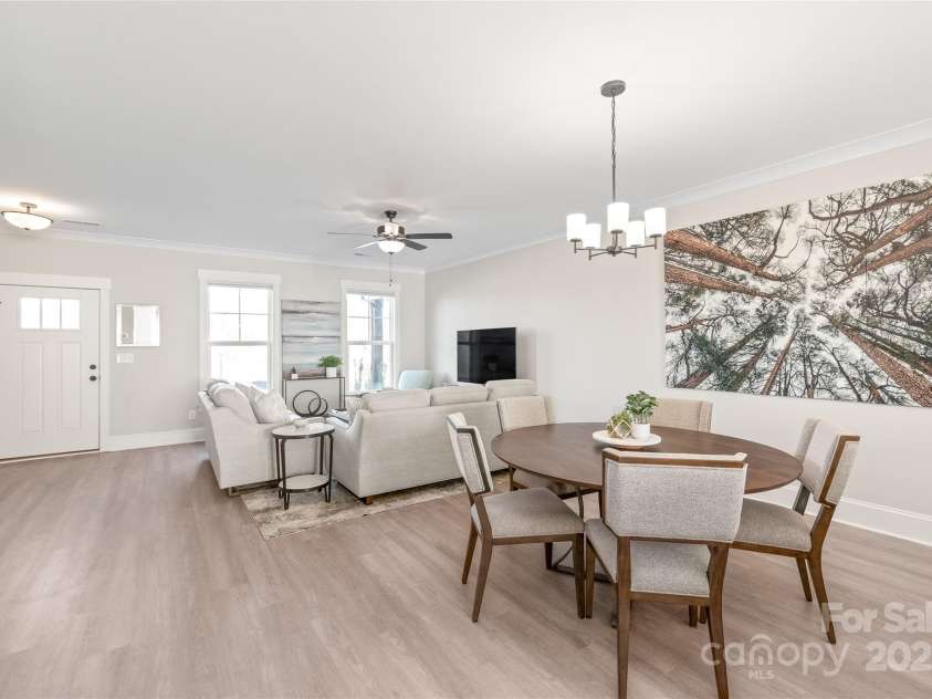 1066 Riverwalk Parkway, Rock Hill, SC 29730.  MLS# CAR4210322, YatesRealty ID 1366. Spacious dining area with lots of natural light between the Chef's kitchen and living room.